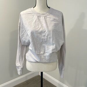 Size L Athleta. Oatmeal colored sweater with thumb holes.